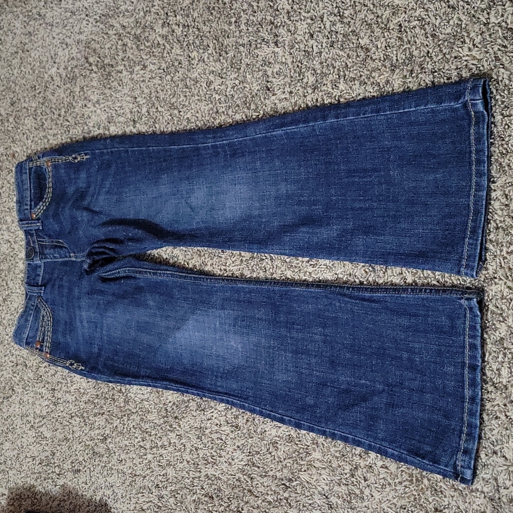 Little girls size 10 reg. Wrangler jeans. Darker wash
